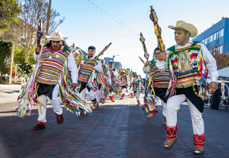 the costumes worn by the dancers bear the image of the virgin mary